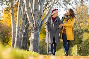 Life Assure Woman With Grandmother Walking In Autumn Park Blog